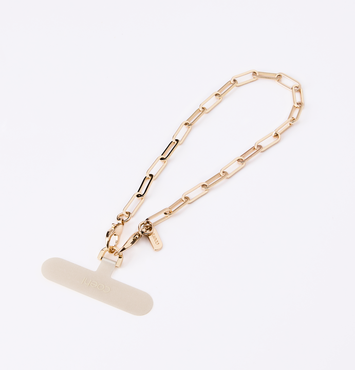UNIQ COEHL GOLDILOCKS UNIVERSAL PHONE CHARM HANDSTRAP - CHAMPAGNE GOLD