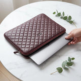 7Wallet 14-Inch Genuine Quilted Leather Laptop Sleeve in Burgundy opened with laptop sliding in