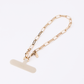 UNIQ COEHL GOLDILOCKS UNIVERSAL PHONE CHARM HANDSTRAP - CHAMPAGNE GOLD