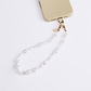 UNIQ COEHL PERLA UNIVERSAL PHONE CHARM HANDSTRAP - PEARL WHITE