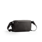 Midnight-black canvas crossbody bag with adjustable strap and zip closure