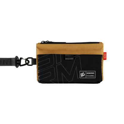 SKINARMA JAGER ripstop clutch bag in brown with black front panel and wrist strap